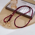 Macro shot of plush leopard print crossbody strap with high-gloss gold metal buckles - Crossbody Chain / Wine Red (K5820)