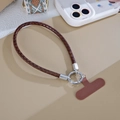 Close-up of brown braided PU leather phone strap with silver ring buckle and T-patch - Brown