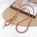 Detail of adjustable orange woven crossbody strap with polished gold metal hardware - Crossbody Chain / Brown (K5845)