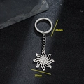 Porte-clés minimaliste en acier inoxydable avec visage de soleil et pendentif de 27mm - Style Art Visage de Soleil