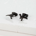 Close-up of matte black dinosaur silhouette stud earrings on a white stone background - Dinosaur Style (143) / Black