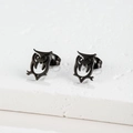 Matte black owl shaped stainless steel stud earrings set on a white stone background - Black (272)