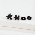 Macro shot of minimalist black puzzle-shaped stainless steel earrings with butterfly backs - Puzzle Shape Style (140) / Black