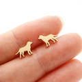 Close-up of cute dog-shaped gold stud earrings on finger showing real size and polish - Dog Style (364) / Gold