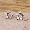 Minimalist hollow star stud earrings in polished silver metal on a natural stone base - Hollow Star Style (898) / Steel
