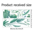 Flat lay showing tropical monstera and cactus wall sticker sheets with size markings - 30x90cmx2 Sheets