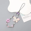 Détail de la lanière de perles pour téléphone avec pendentif papillon rose et étoiles - Rose