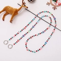 Detailed view of Christmas phone charm with festive beads and Santa ornaments on white surface - Crossbody Chain / Square Rhinestone Christmas Beaded Style (K2201)