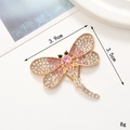 Detailed macro view of a 3.9x3.5cm dragonfly brooch with pink and white rhinestones - Gold Rhinestone Dragonfly