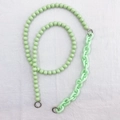 Detail view of light green acrylic phone lanyard with faceted beads and chunky chain links - Light Green