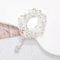 Macro detail of a vintage silver brooch with a large oval crystal and teardrop pendant - Silver Base White Gem (D1337)
