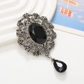 Baroque black gemstone pendant with silver alloy frame and droplet charm on white stand - Antique Silver Black Gemstone Pendant