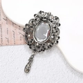 Detail of vintage silver brooch with dark grey rhinestones and elegant teardrop pendant - Ancient Silver Cameo (D1335)