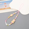 Detail von flauschigem rosa Puppenanhänger und bunten Blumenperlen für Handykette - Handykette / Rosa Beflockter Hamster Handy-Anhänger