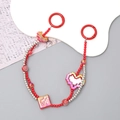 Close-up of red beaded phone strap with pixel heart and Fu character lucky charms - Lucky Blessing Heart Beaded (K2812)