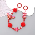 Macro shot of red beaded phone chain with fuzzy pompom and metallic star charms - Plush Bear Style (K2809)