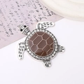 Macro shot of silver alloy turtle pendant with brown enamel shell and sparkling rhinestones - Coffee (D2318)