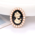 Vintage oval cameo brooch with golden lady silhouette and white pearls surrounding the edge - Black Lady Portrait