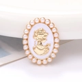 Oval vintage cameo charm with golden lady silhouette and white faux pearl border - White Lady Portrait