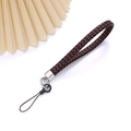 Red and black woven leather phone strap with silver metal clasp on white background - Charm / Burgundy
