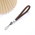 Macro detail of hand-woven black and brown leather lanyard with silver metal clasp hardware - Charm / Light Coffee
