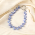Dettaglio cinturino per cellulare con perle di cristallo lavanda e fibbia in metallo argento - Ciondolo in Perline a Goccia d'acqua Viola (K3152)