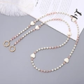 Chic beaded phone chain with pearls, pink crystals, and white heart charms on grey background - 120cm Crossbody Chain / Pink
