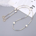 Detailed close-up of pearl and heart bead strap with golden metal clasp and white feathers - 120cm Crossbody Chain / Gray Multi-color