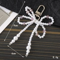 Porte-clés nœud en perles fait main avec cristaux roses, hauteur 9 cm, élégant - Breloques / Rose