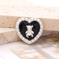 Macro shot of heart charm with black enamel, silver bear, and white pearl trim detail - Pearl Heart Bear - Silver Black (D2644)