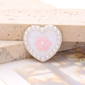 Detail view of heart-shaped shoe charm with white pearls and pink flower center - Enamel Pearl Camellia - Silver Pink (D2649)