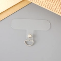 Macro shot of a clear PVC phone lanyard connector pad with silver metal D-ring attachment - Transparent Silver Buckle