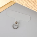 Close-up of clear T-shape phone lanyard tether tab with silver D-ring buckle - Transparent Gun Black Buckle