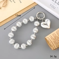 Detail showing a 13cm silver beaded bag chain with a polished heart pendant for accessories - Heart Pendant Style (K3378) / Silver Plated Pumpkin Beaded Hanging