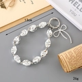 Silver beaded phone strap with fluid metallic beads and bow pendant, length 13cm and weight 26g - Irregular Beaded with Bow Style (K3380) / Silver Plated Irregular Beaded Hanging