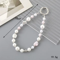 Detail view of a 15cm handmade beaded keychain with pearls, pink heart and silver beads - Charm / Irregular Pink Pearl Pendant
