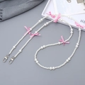 Chic pearl phone strap with pink bow accent and silver metal clasp for women - Crossbody Chain / Pink Bowknot