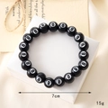 Close-up of black beaded bracelet with number eight motifs and dimension markings - Billiards Black Eight Beaded Bracelet