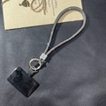 Close-up of sparkling grey rhinestone phone lanyard with silver metal clasp and connector - Black