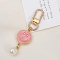Pink marble smile face keychain with gold ring and white pearl on textured cloth - Faux Shell Smiley Style (K3607)