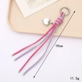 Porte-clés nœud en cuir PU rose et lilas avec breloque cœur argentée et mousqueton - Porte-clés Tressé Nœud Diamant (K3913) / Rose Vif+Violet