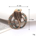 Vintage bronzen cobra slangenbroche met blauwe strassteentjes in een rond ontwerp - Blauwe Strass Cobra Oud Goud (D2929)