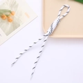 Detail of black and white woven cord with loop knot and plastic tips for accessories - White