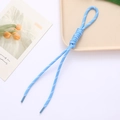 Macro detail of hand-woven light blue camera rope with durable dark blue heat-shrink ends - Sky Blue