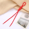 Detail of red woven phone strap with intricate roman knots and polished plastic ends - Red
