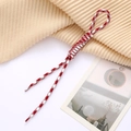 Detail of red and white houndstooth woven rope with reinforced loop and plastic tips - White + Red
