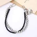 Dual-strand silver and black bead phone charm with a metallic heart pendant and clasps - Silver and Black Beaded Hand Chain (K4270)