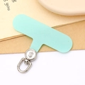 Detail of mint green T-shaped phone tether tab with silver rotating metal dollar sign clip - Light Green (Silver Buckle)