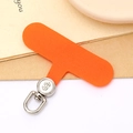 Close-up of orange fabric phone tether tab with a rotating silver metal dollar sign hook - Orange (Silver Buckle)