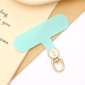 Close-up of mint green fabric phone tether tab with golden swivel hook and dollar sign - Light Green (Gold Buckle)